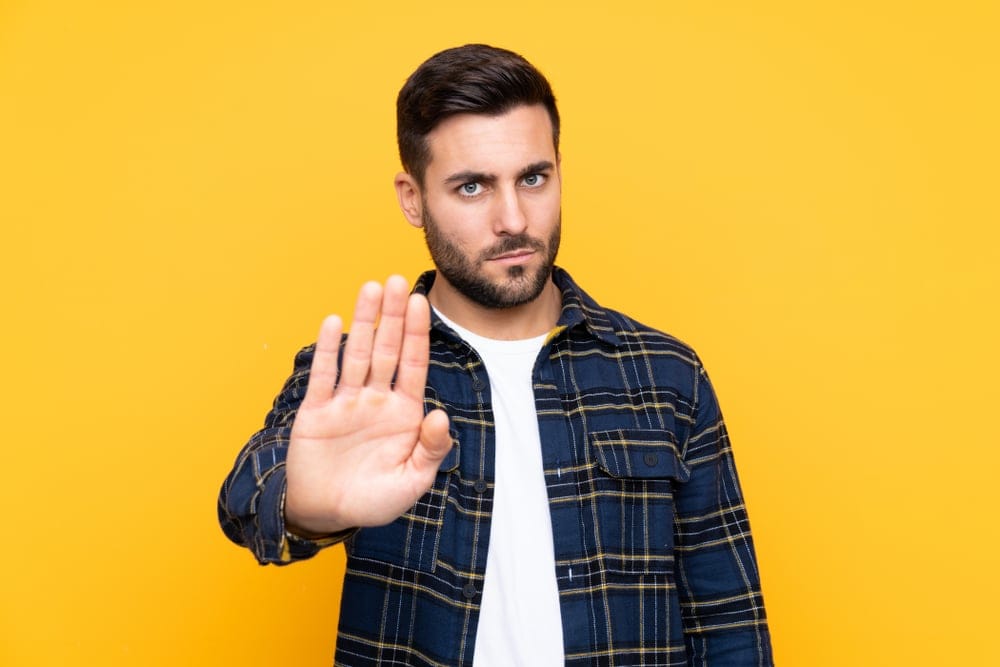 Young,Handsome,Man,With,Beard,Over,Isolated,Yellow,Background,Making