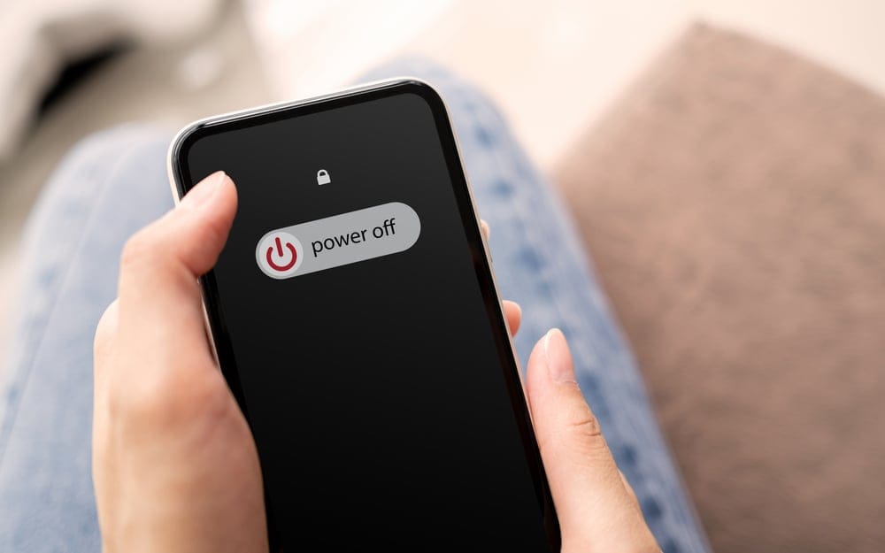 Woman,Hand,Using,Is,Sliding,To,Turn,Off,The,Mobile