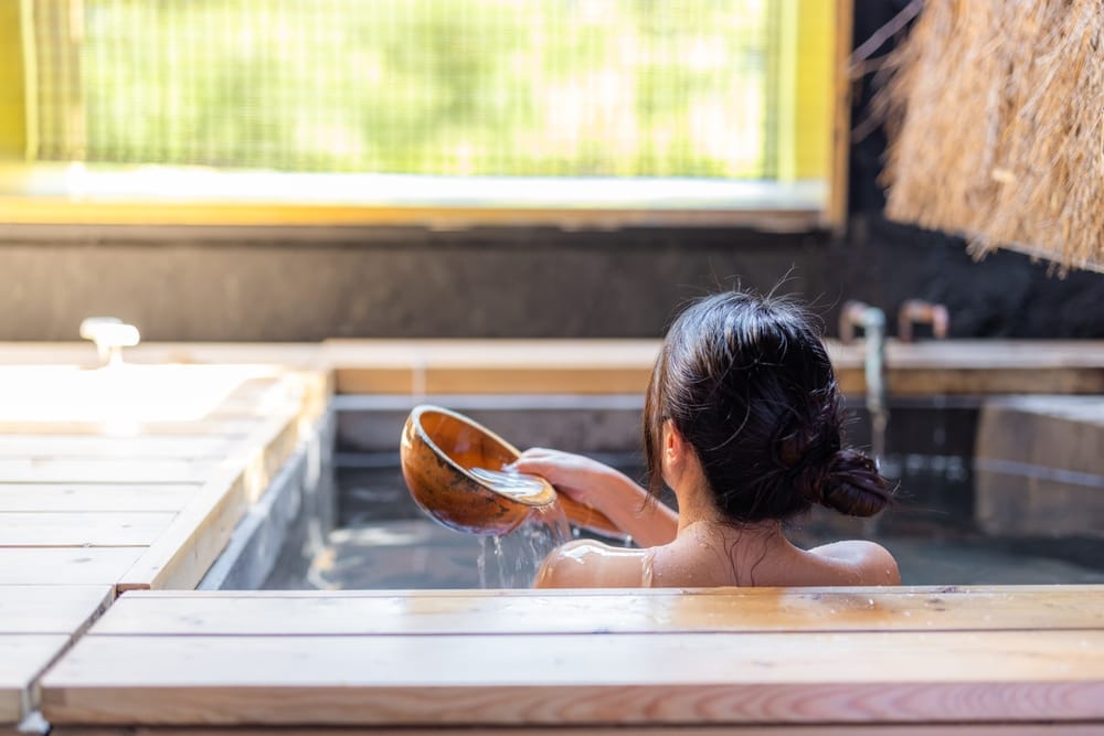 Woman enjoying a warm bath.