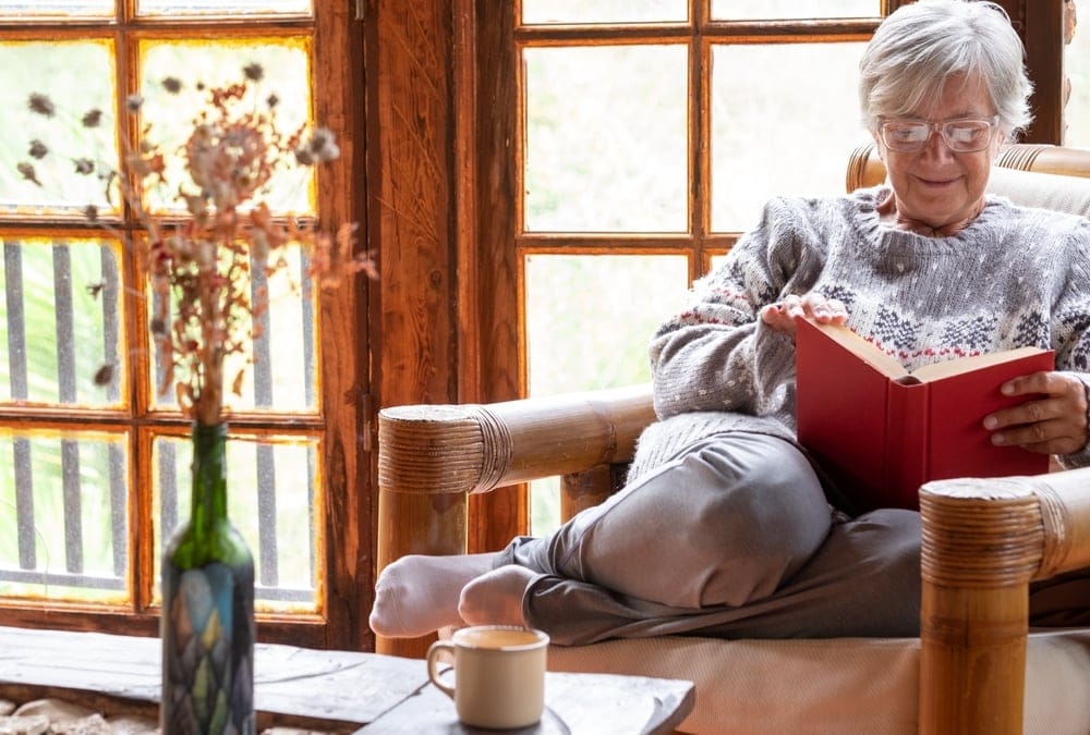 Attractive,Relaxed,Senior,Woman,Sitting,At,Home,In,An,Armchair