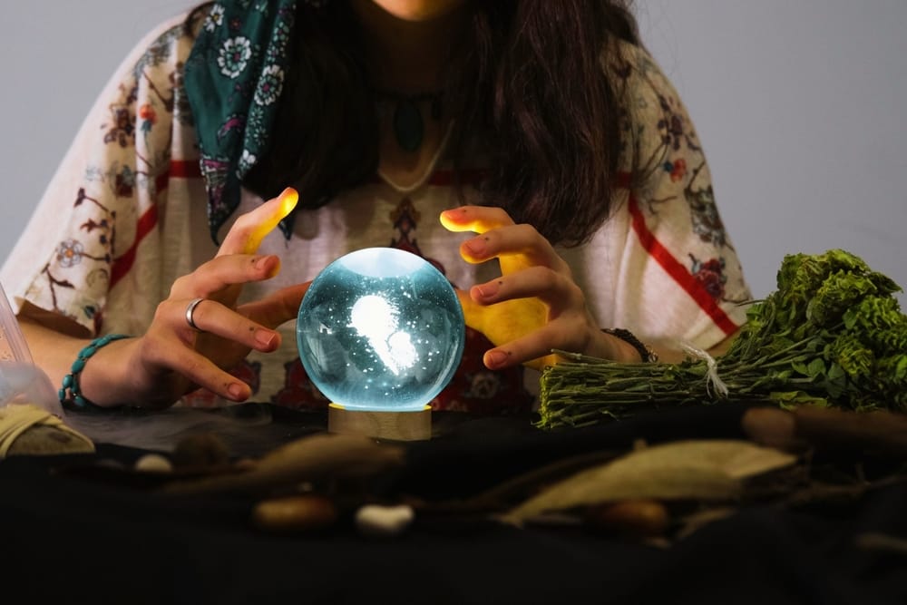 Woman looks into a crystal ball.