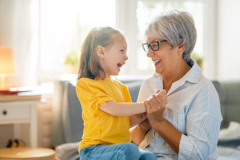 A grandmother with her granddaughter.