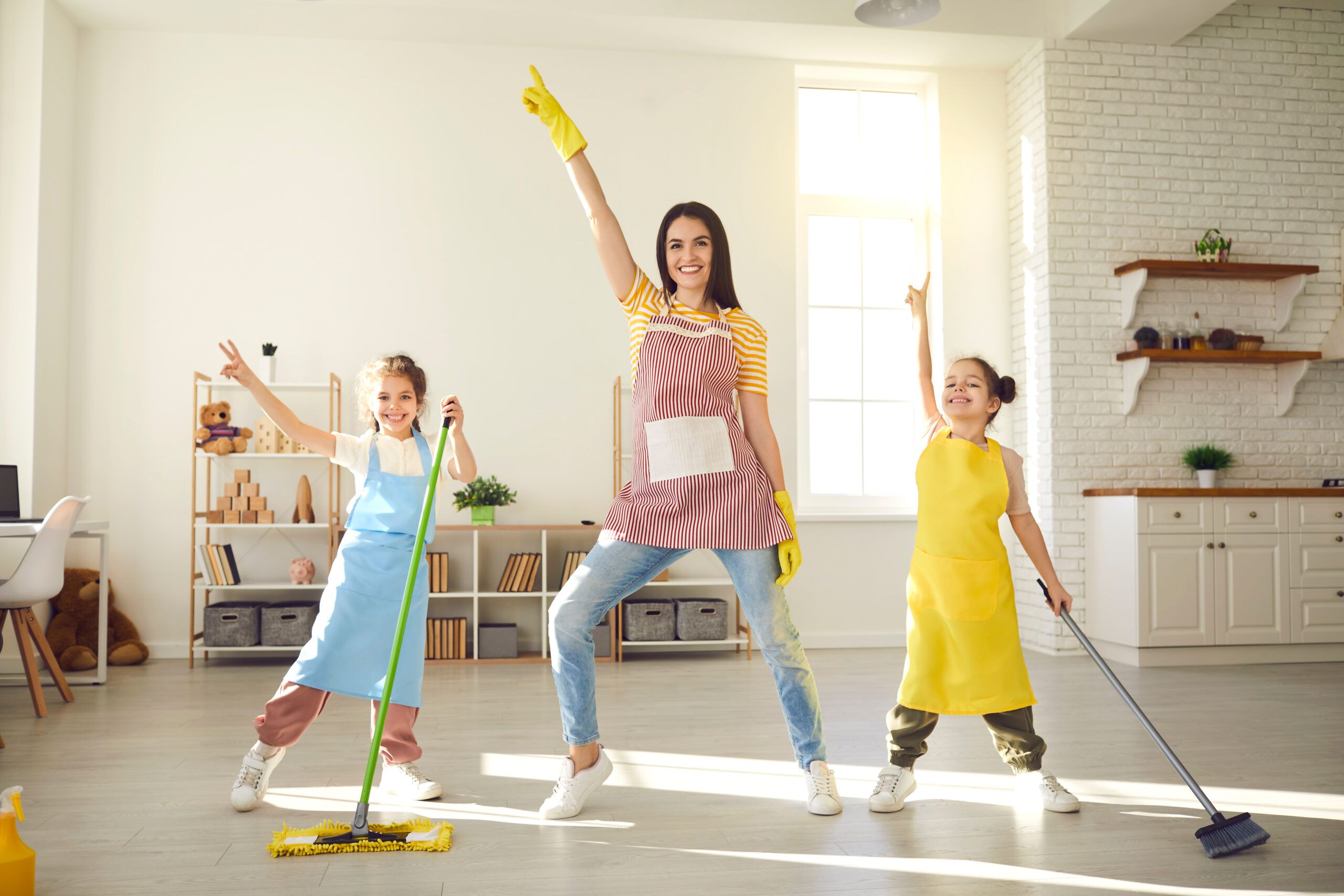 Mom and daughters having fun doing chores.