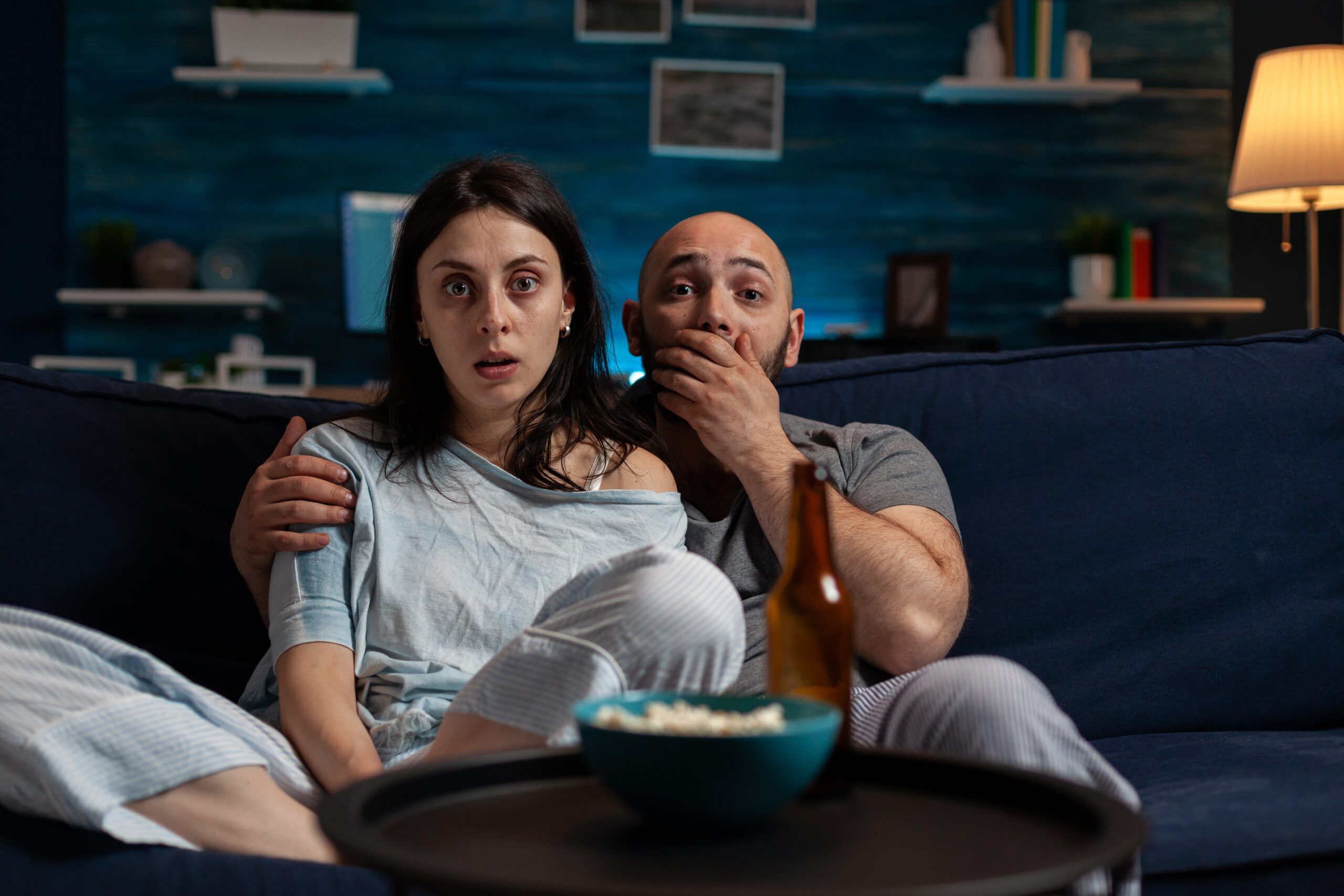 Couple watching TV together.