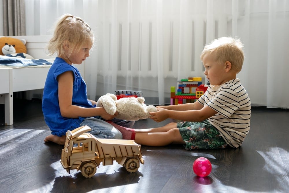 Little children playing at home.