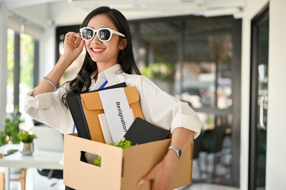 Woman resigning from her job and happy about it.