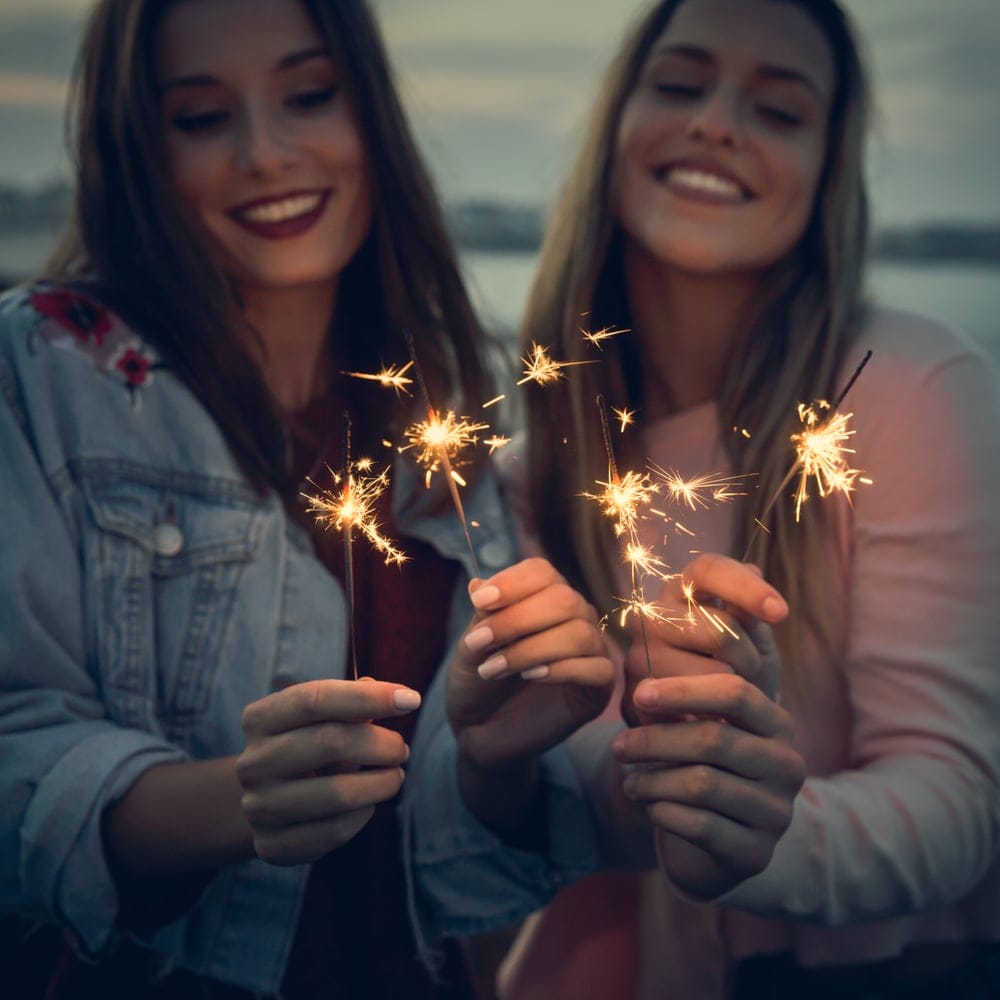 Two friends celebrating together.