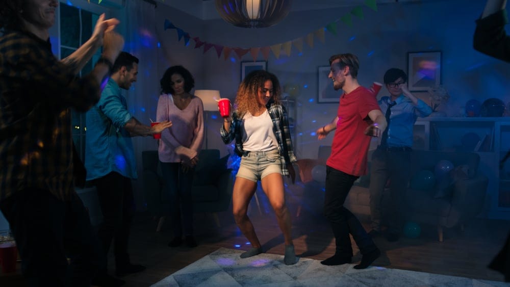 Young adults drinking at a house party.