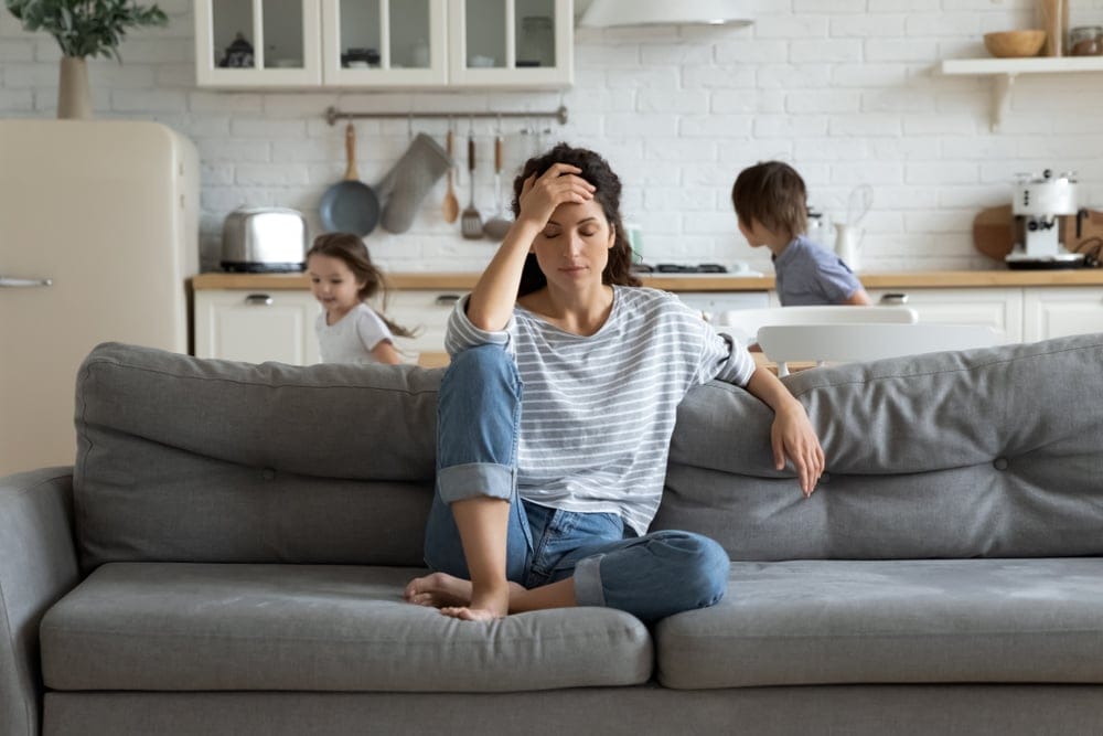 Tired mom with children running amok.