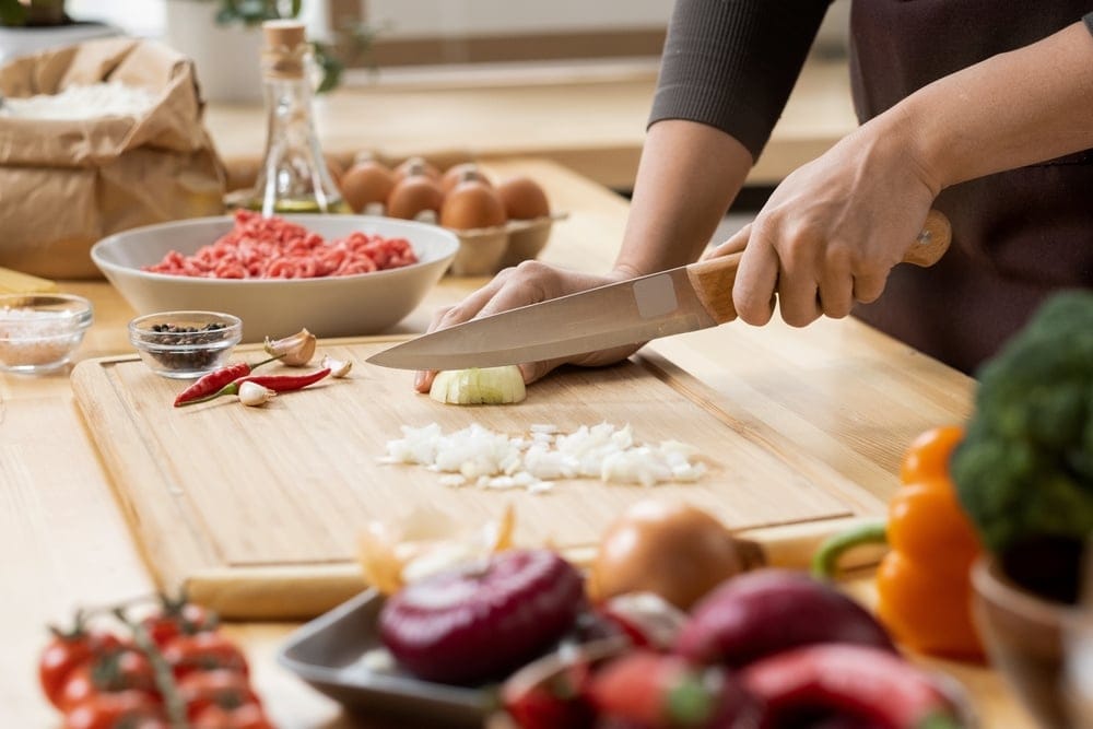 Woman cutting onions.