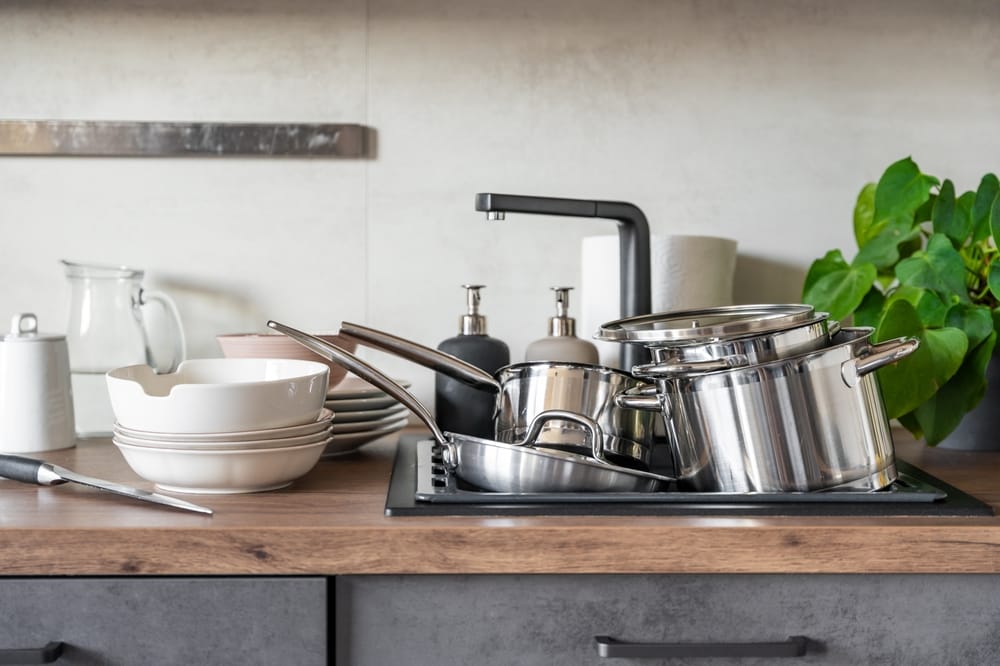 Dirty dishes near sink.