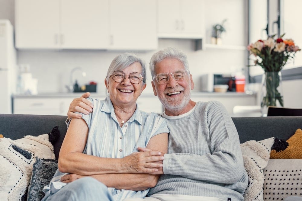 Happy husband and wife smiling together.