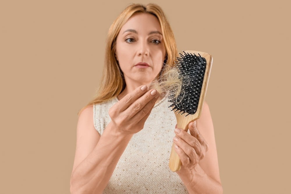 Woman brushing her hair.