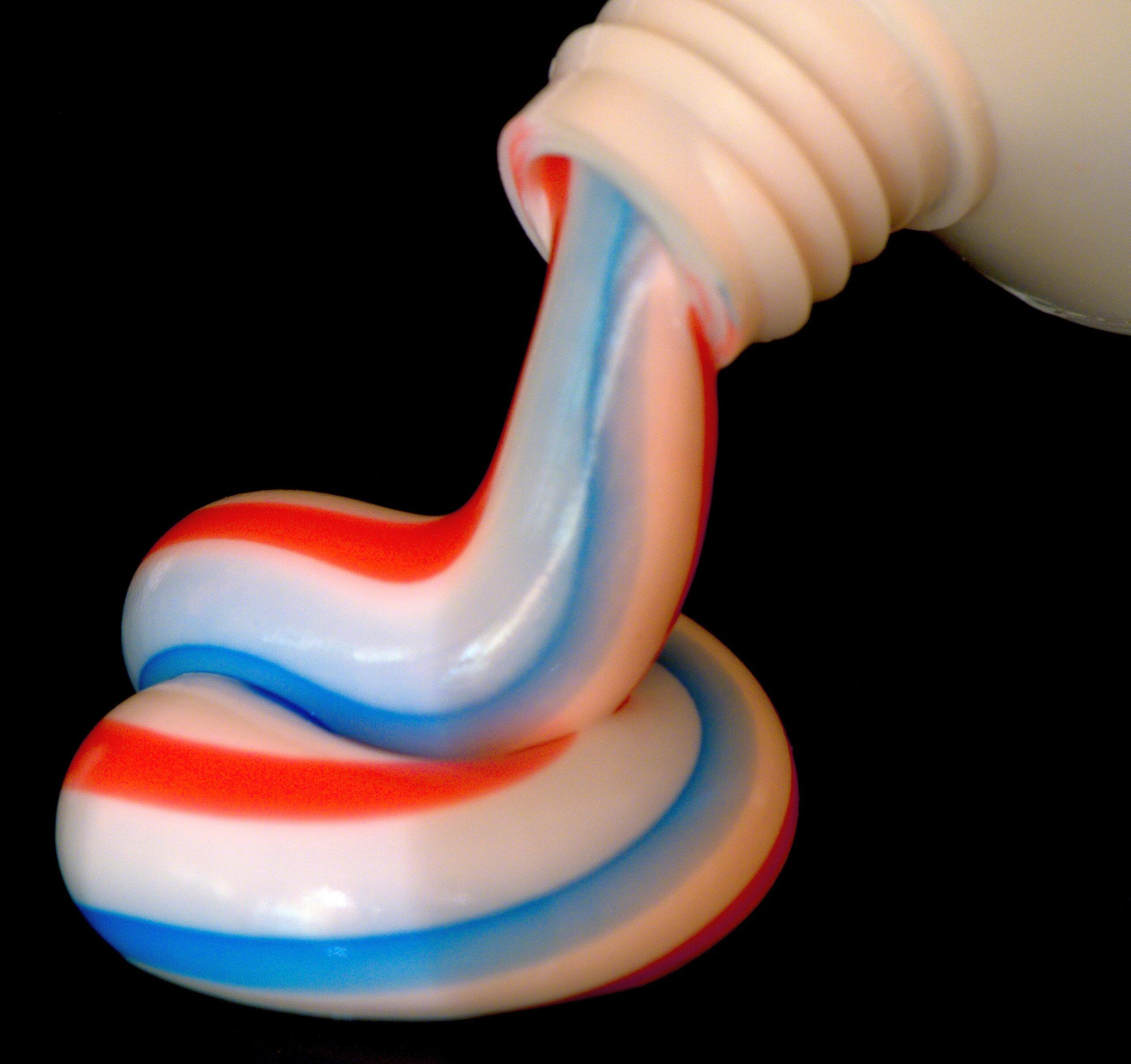 Toothpaste coming out of a tube.