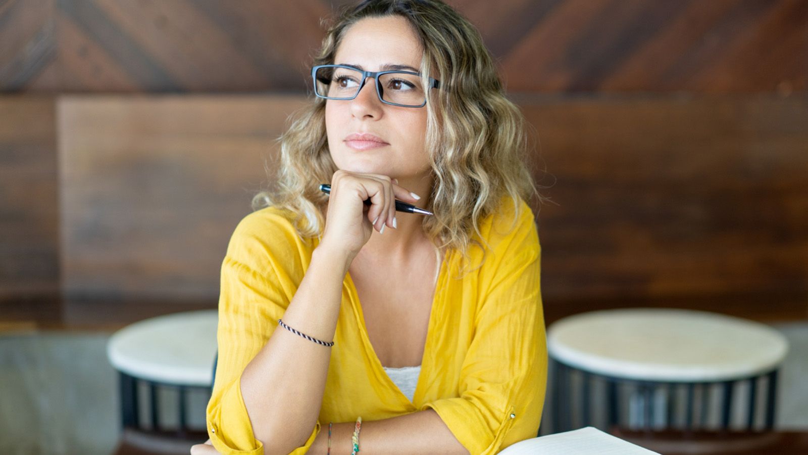 Woman pensive and staring off into the distance.