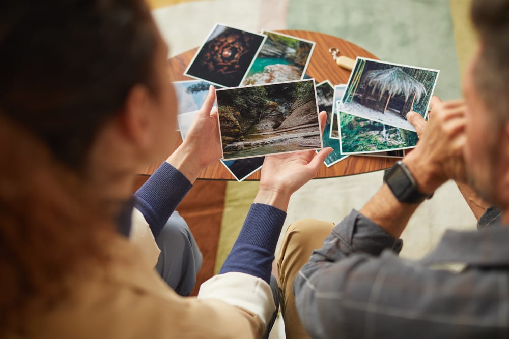 A young couple looking at pictures