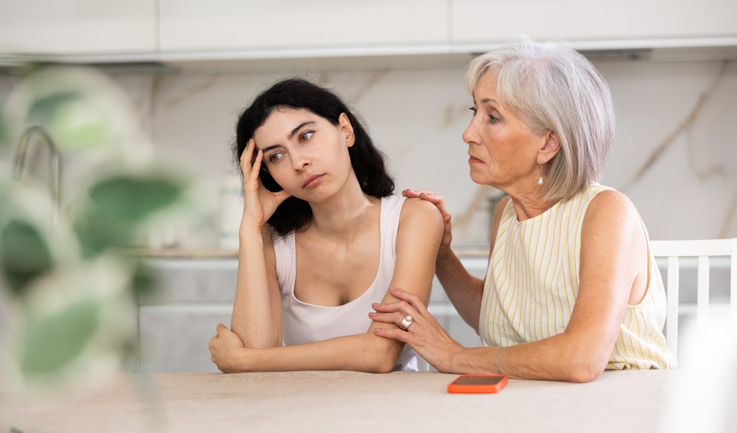 A mother is feeling distance from her adult daughter.