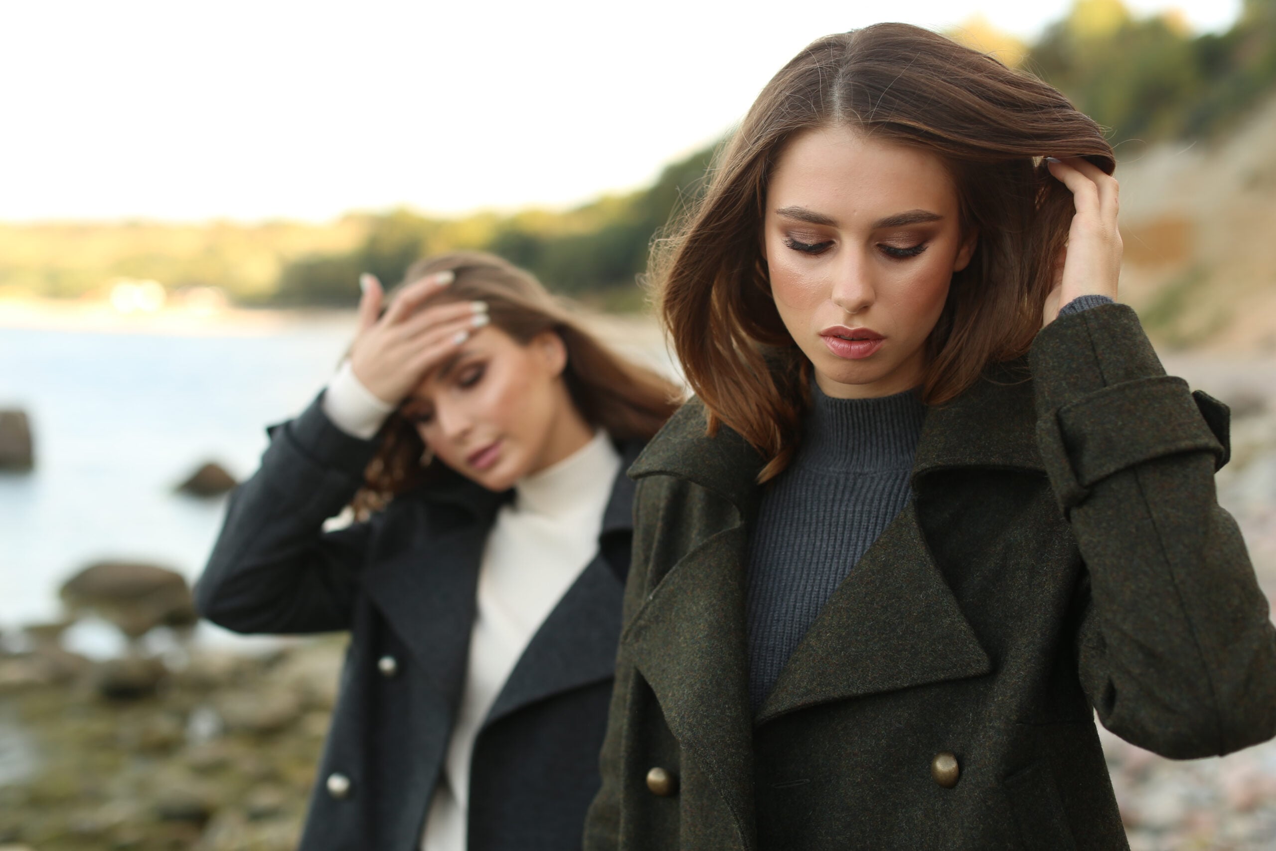 Two female friends having a disagreement while on a walk.