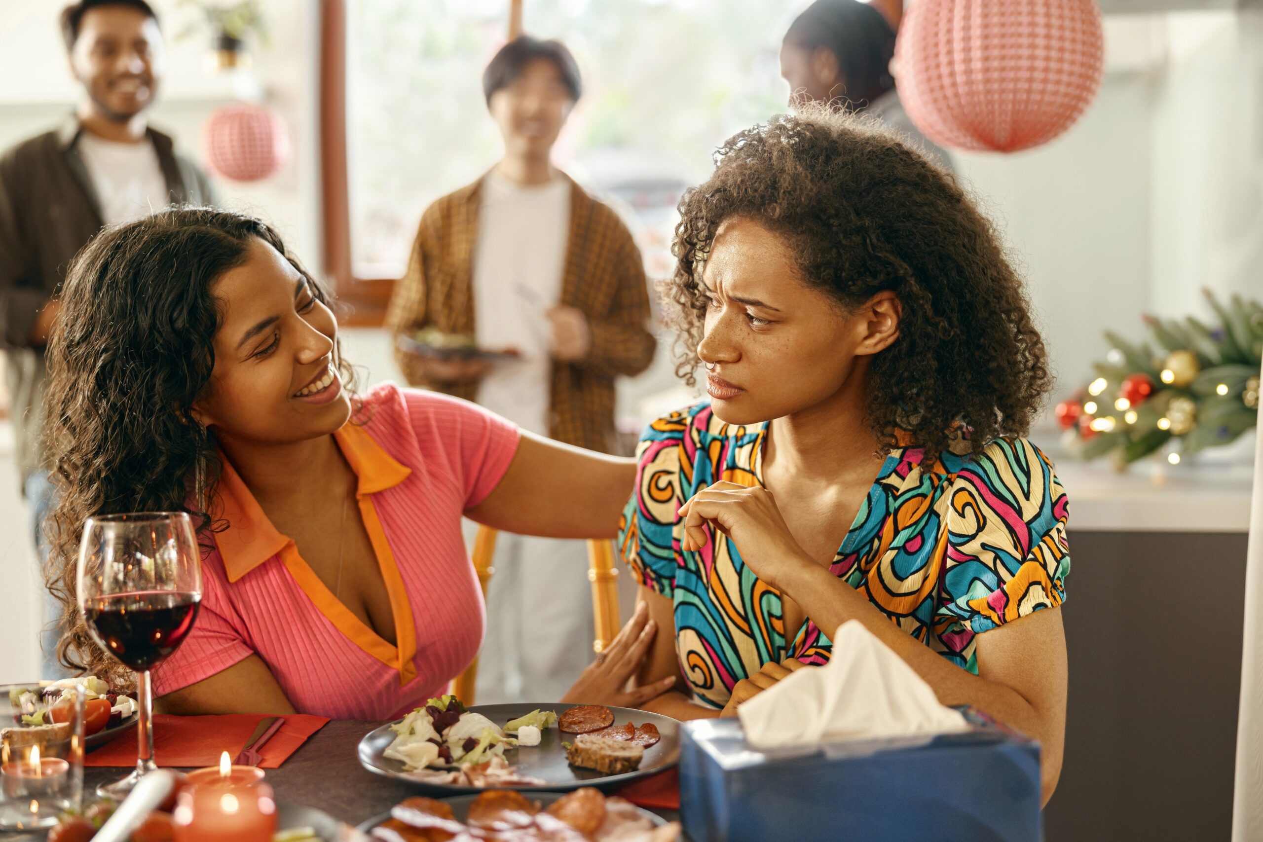 A woman acting as a fake friend to another woman.