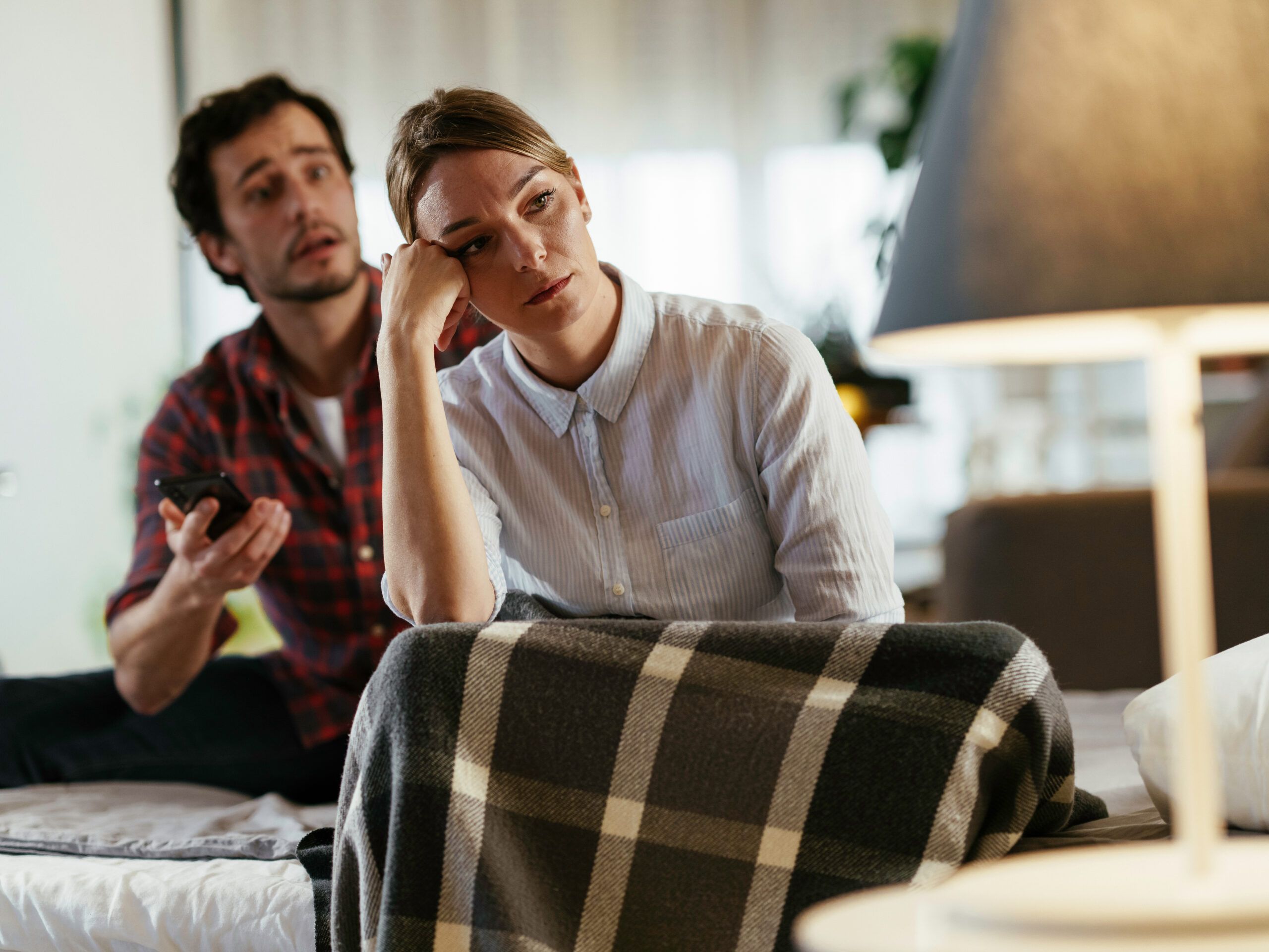 A woman trying to explain to her husband that something feels missing.