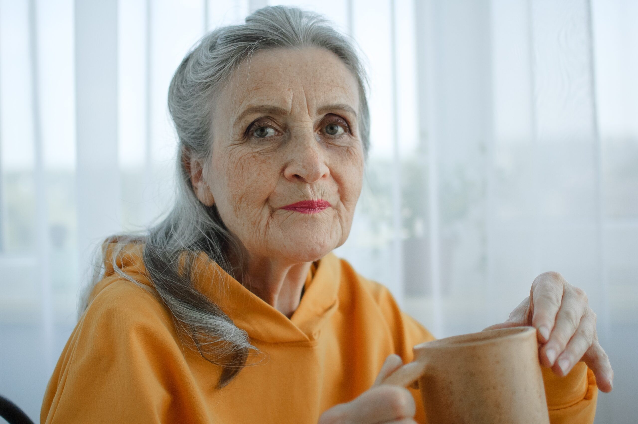 A withdrawn midlife woman alone at home after cancelling plans.