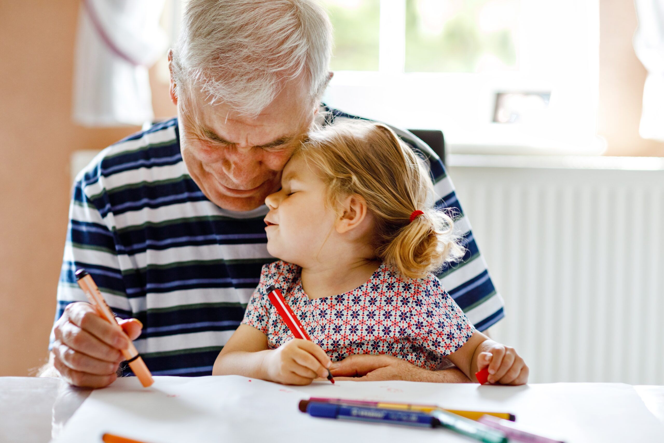 A little girl adoring her grandfather.