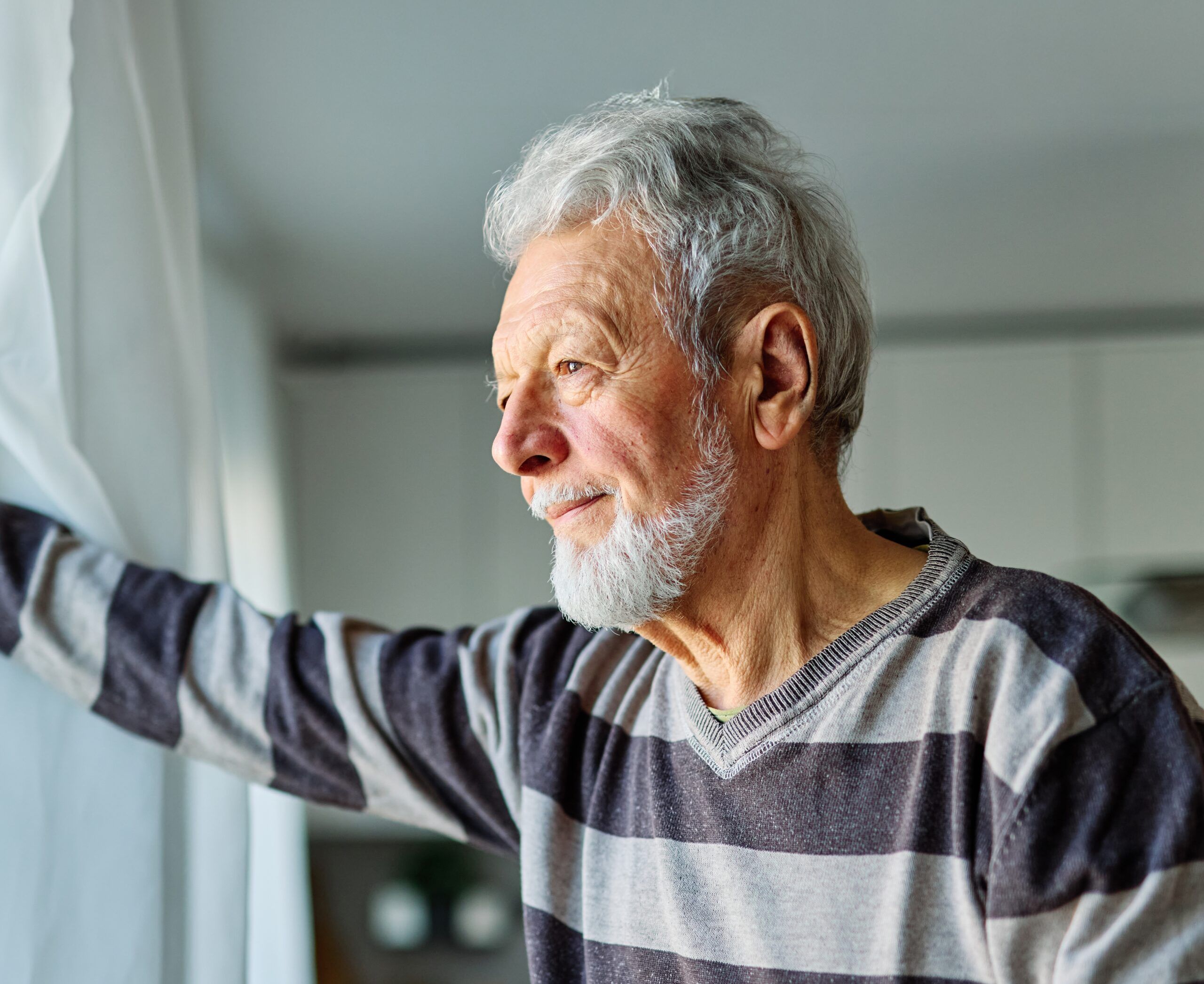 A mature retired man thinking about his identity and purpose.