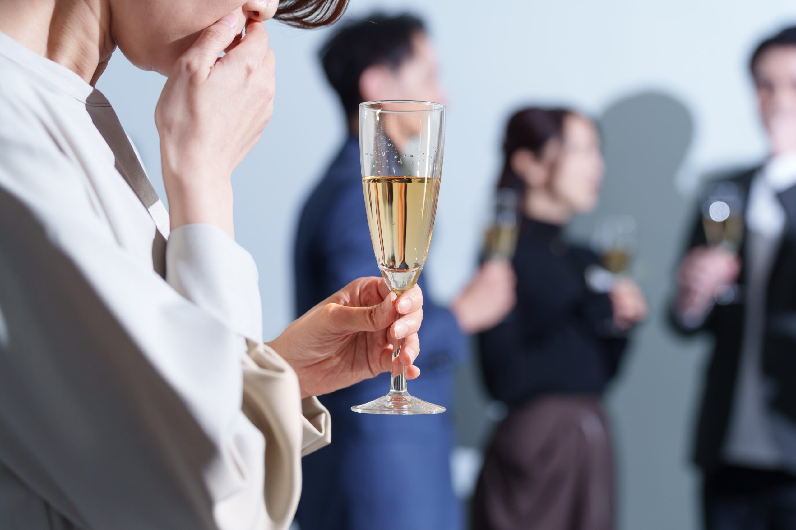 A woman at a party who feels she is not good at socializing.