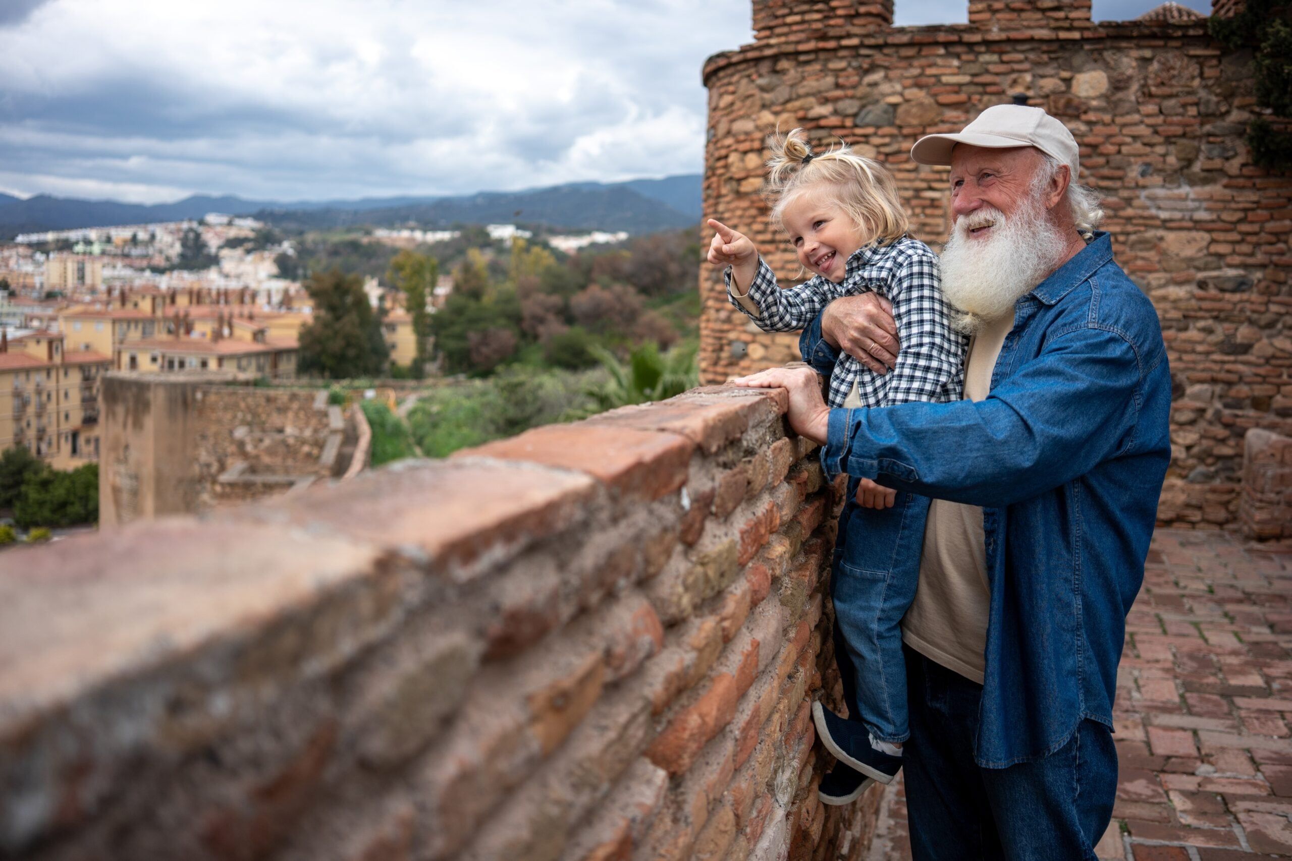 A loving grandfather joyfully spending time with his growing granddaughter.