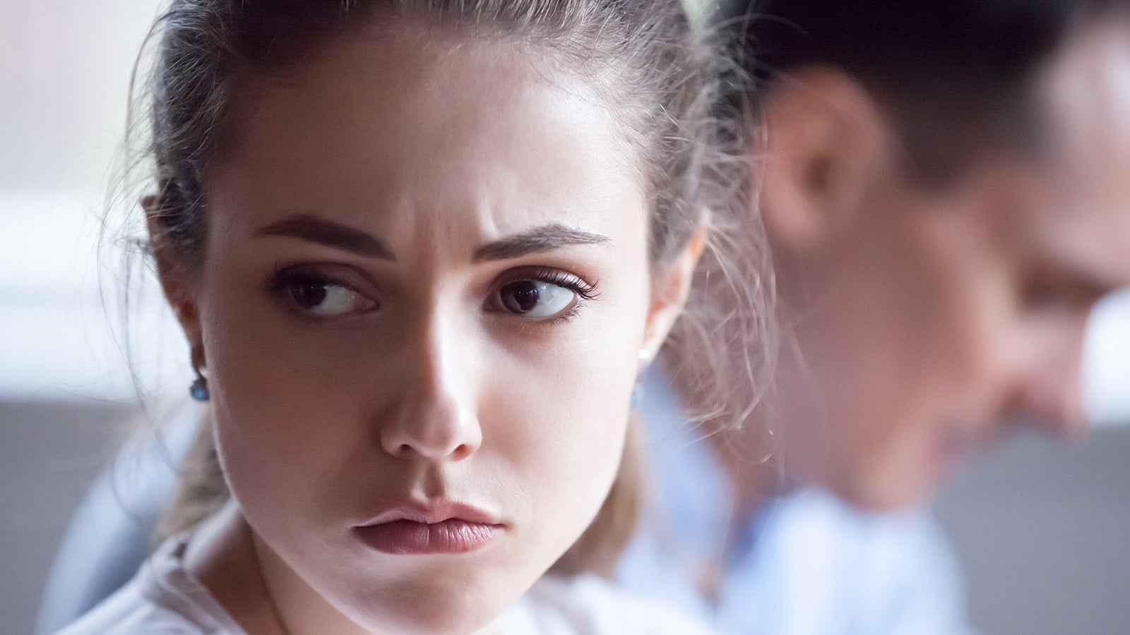 Close up of pretty sad woman feel upset after family fight, spouses avoid talking after disagreement, offended wife angry having dispute or misunderstanding with husband, mad spouses ignore each other
