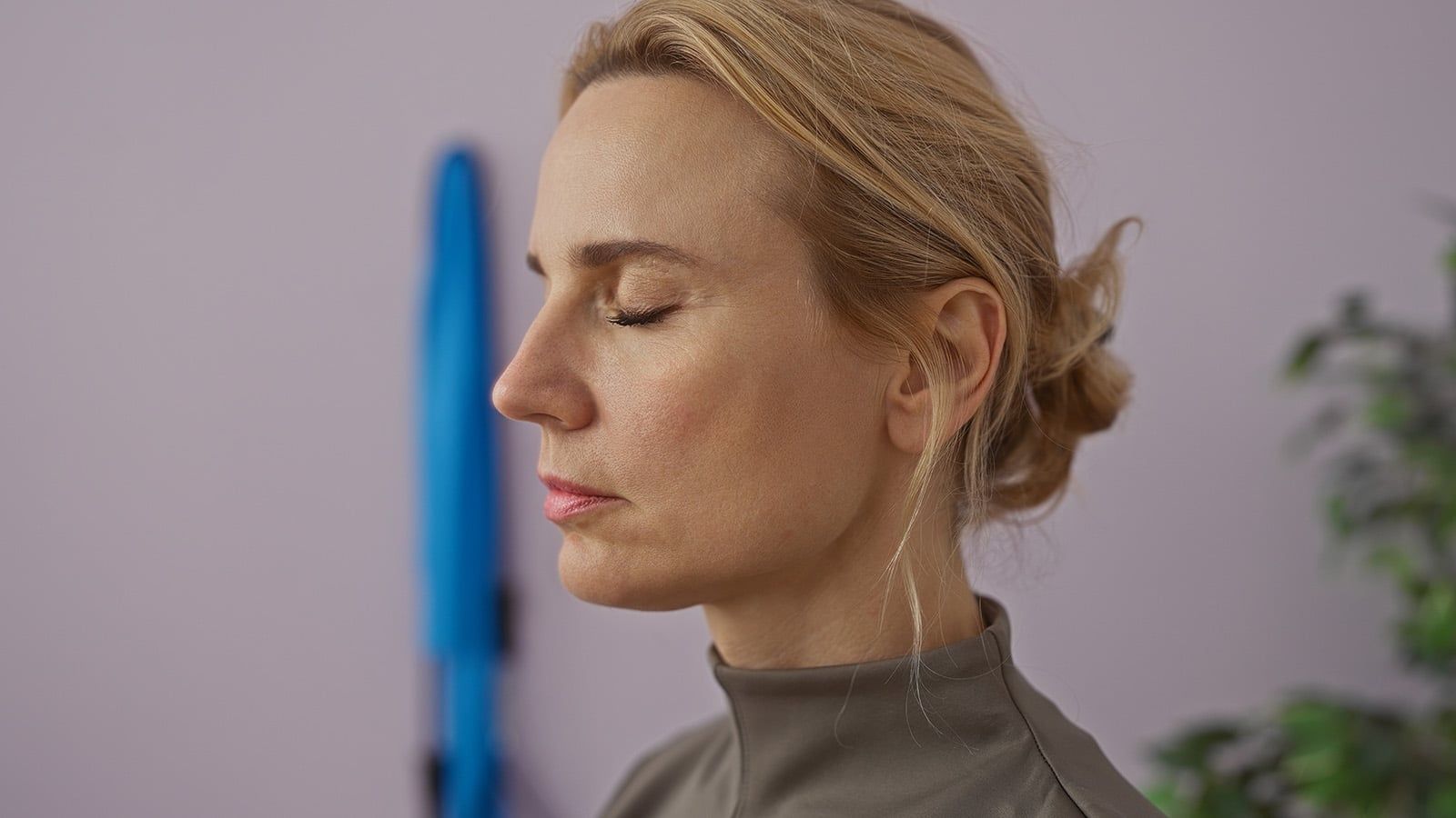 Pretty middle aged woman meditating