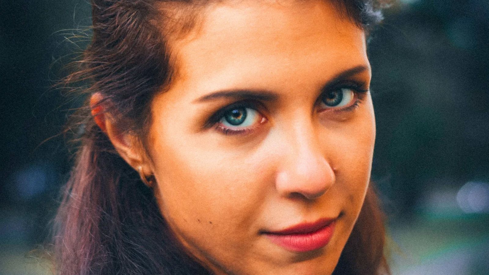Close up portrait of european green-eyed girl with brown hair