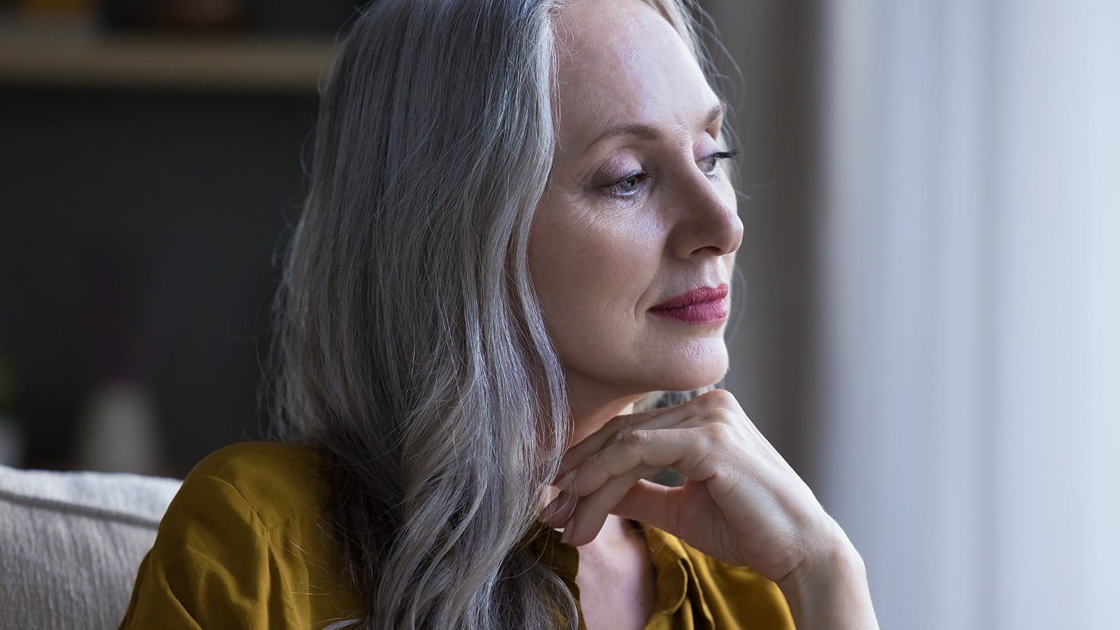 Gorgeous older woman pensive and reflective