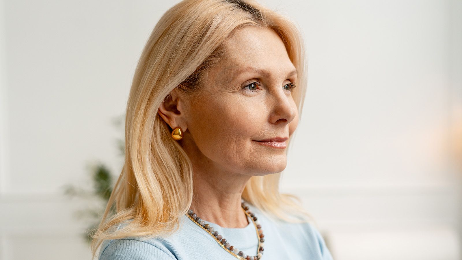 Woman in her 60s thinking about the solitude that comes from aging.