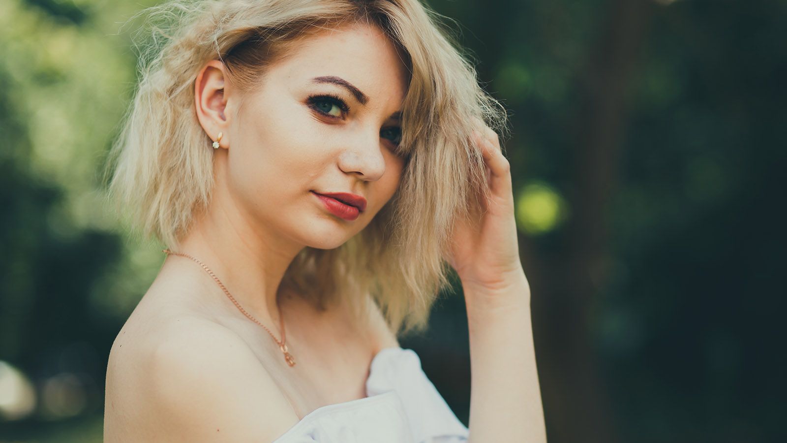Young independent woman staring into camera looking confident