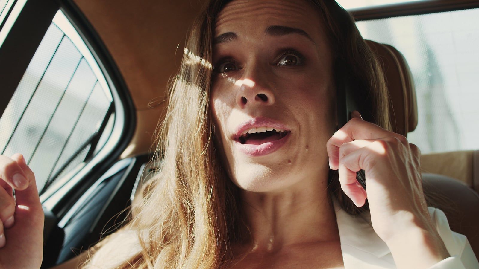 Anxious woman talking on the phone