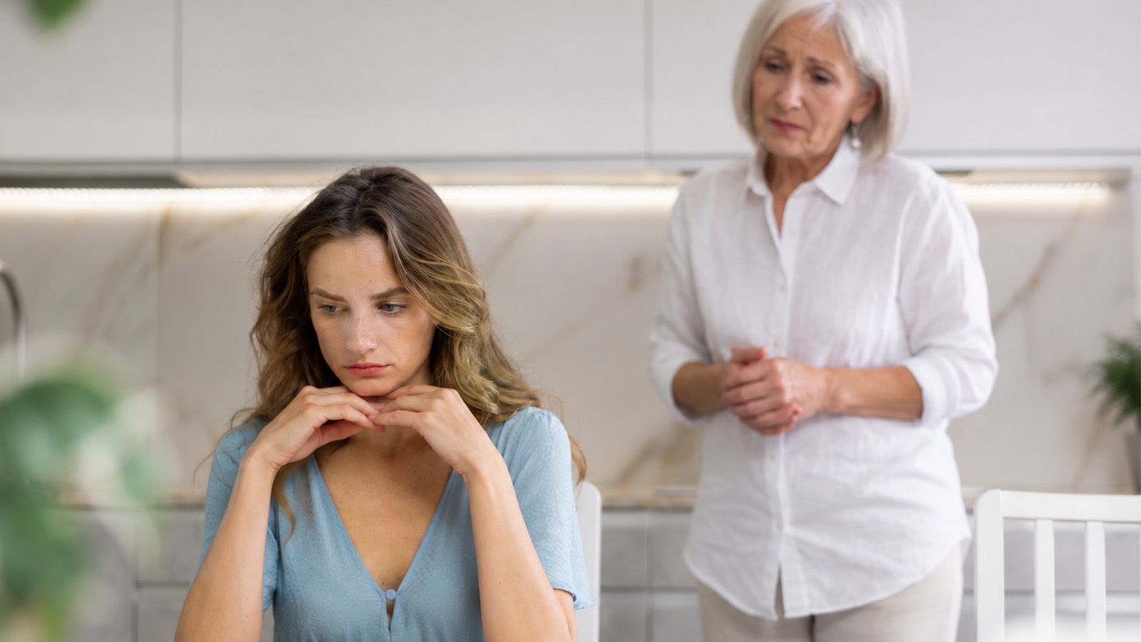 Woman in her 60s reflecting on how she parented her adult daughter, looking sad