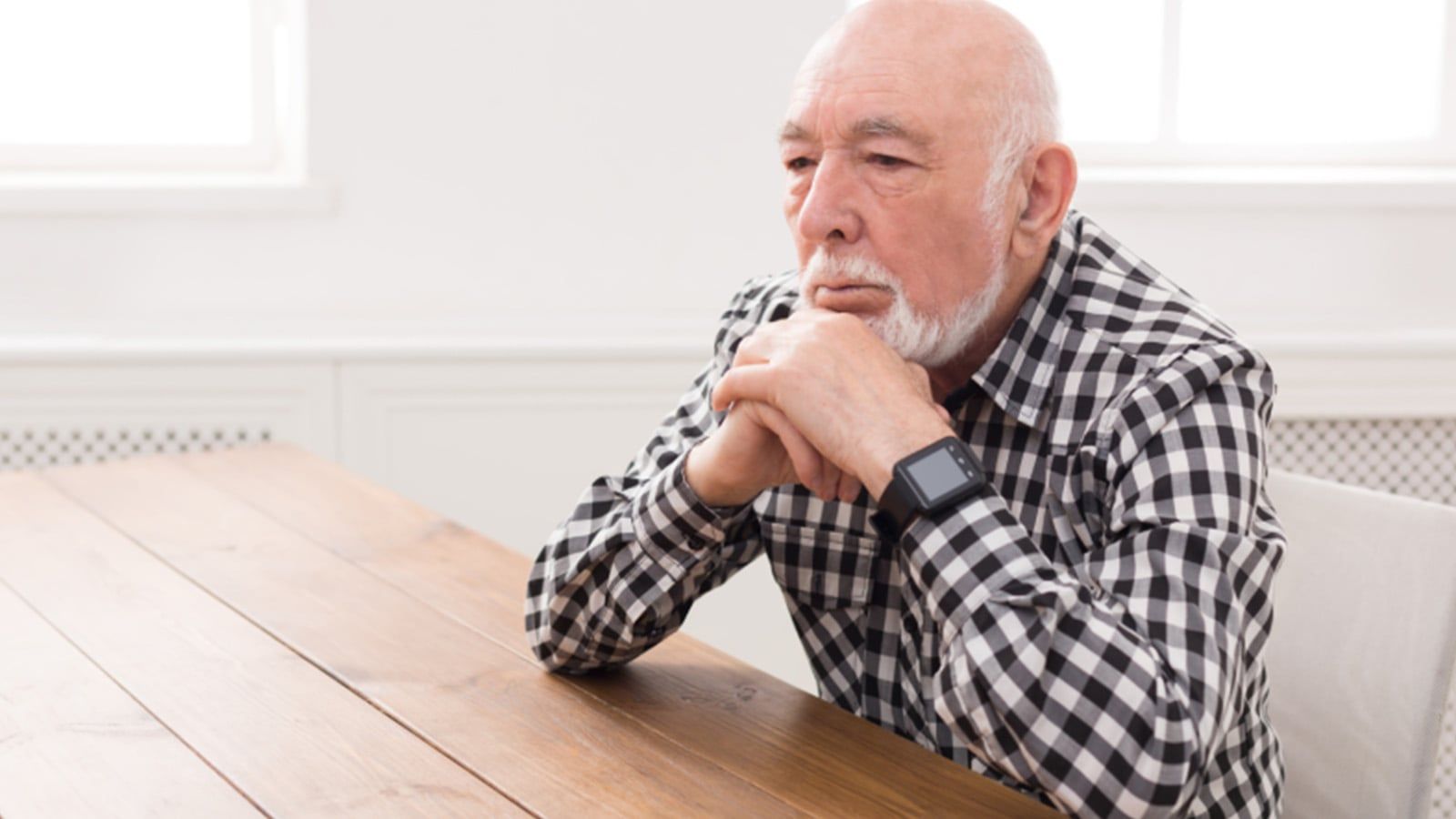 Retired man feeling bored.