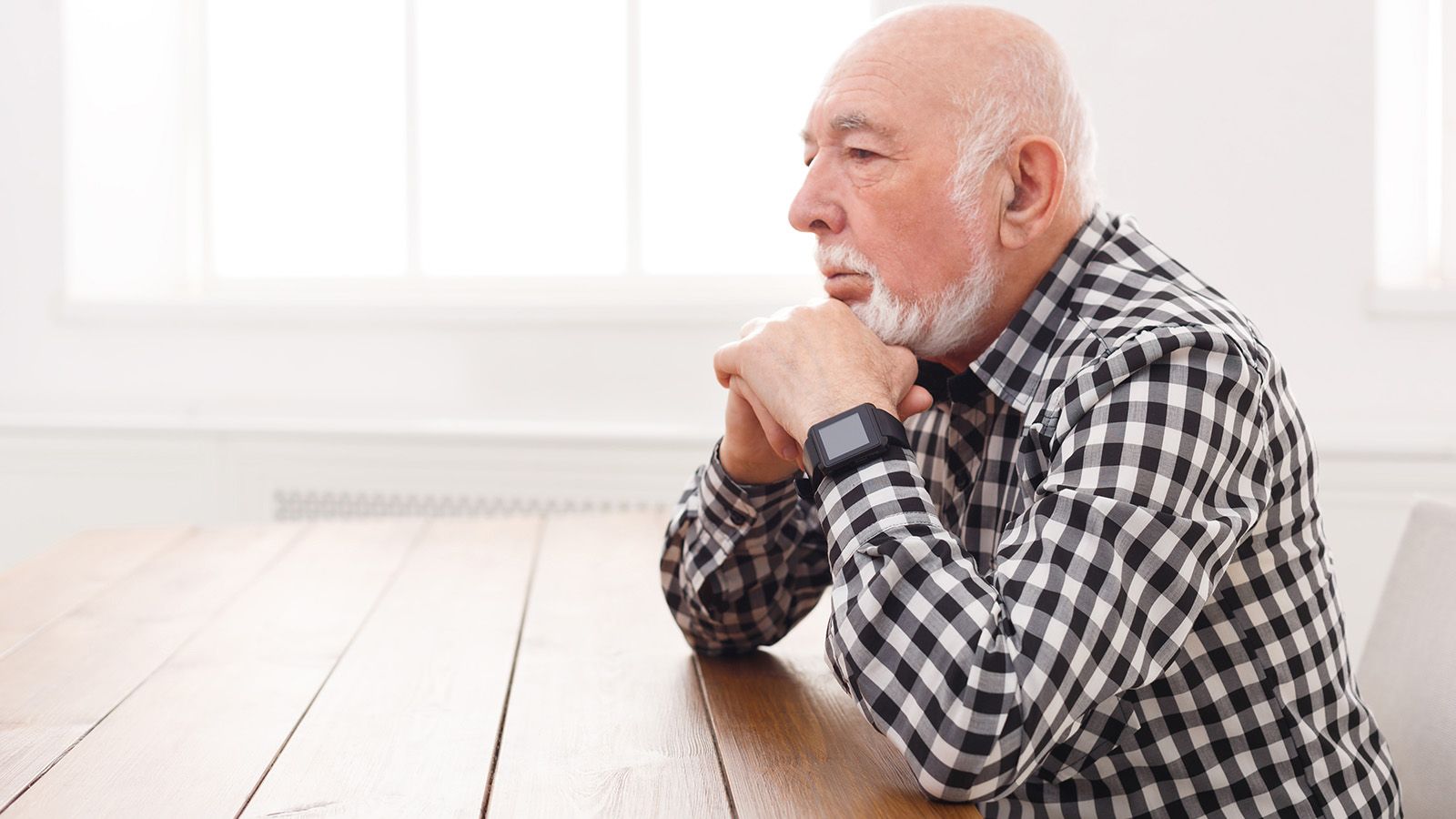 Pensive retired man thinking about his relationships in the past
