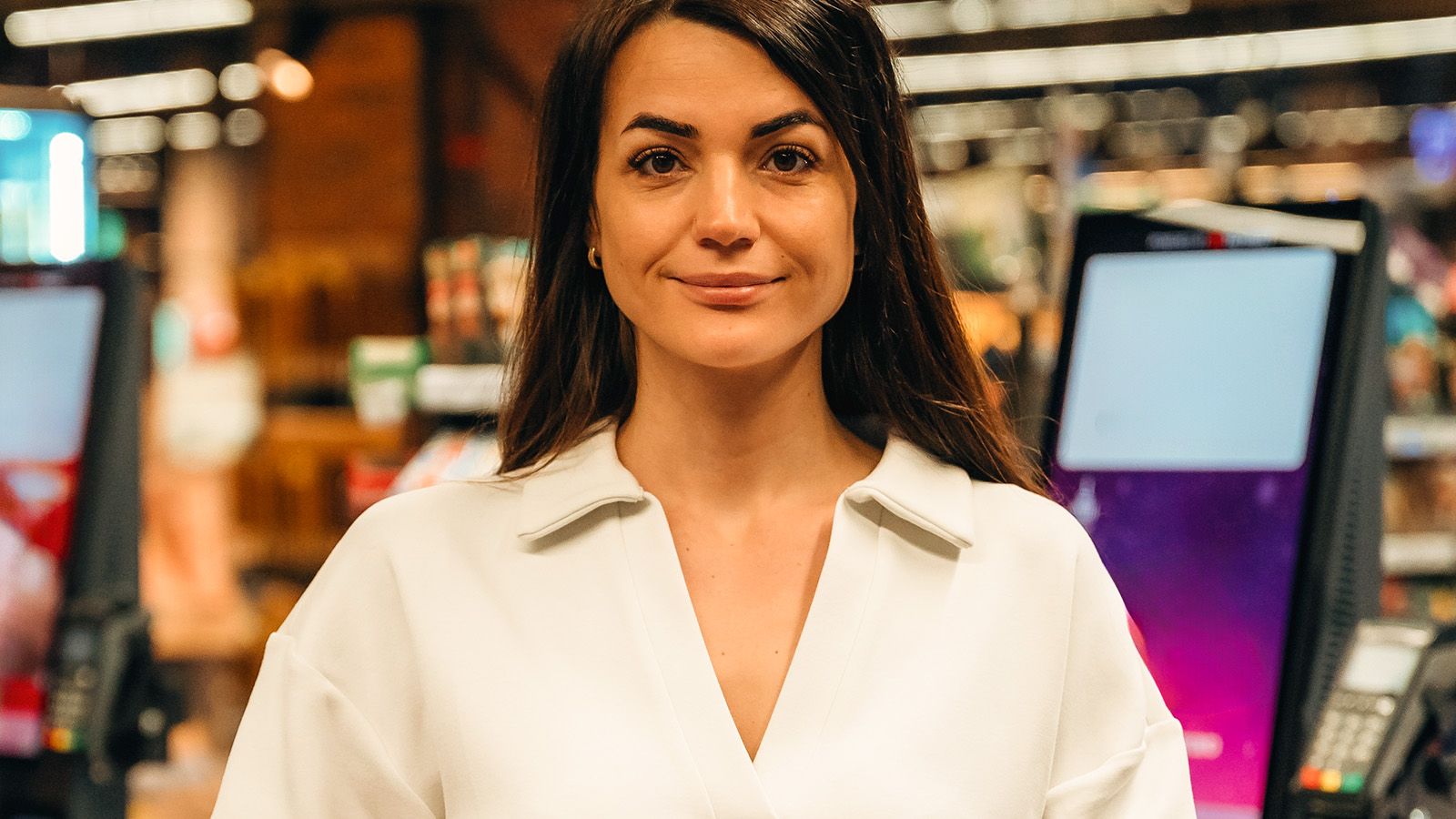 Woman at store checkout counter