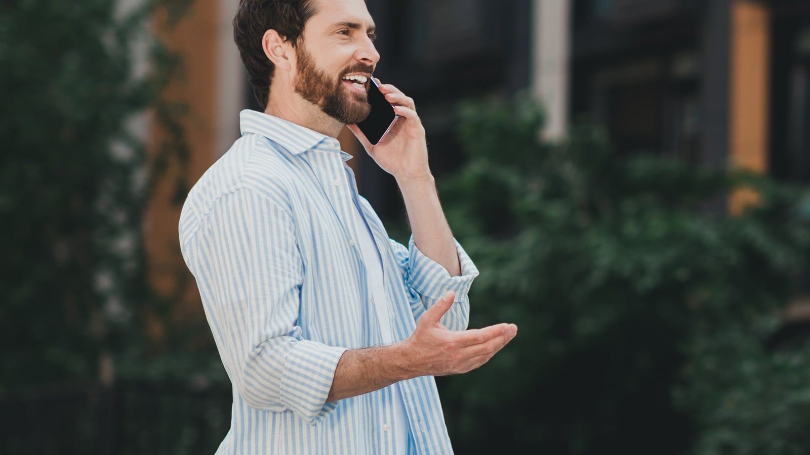 Man talking on phone walking around