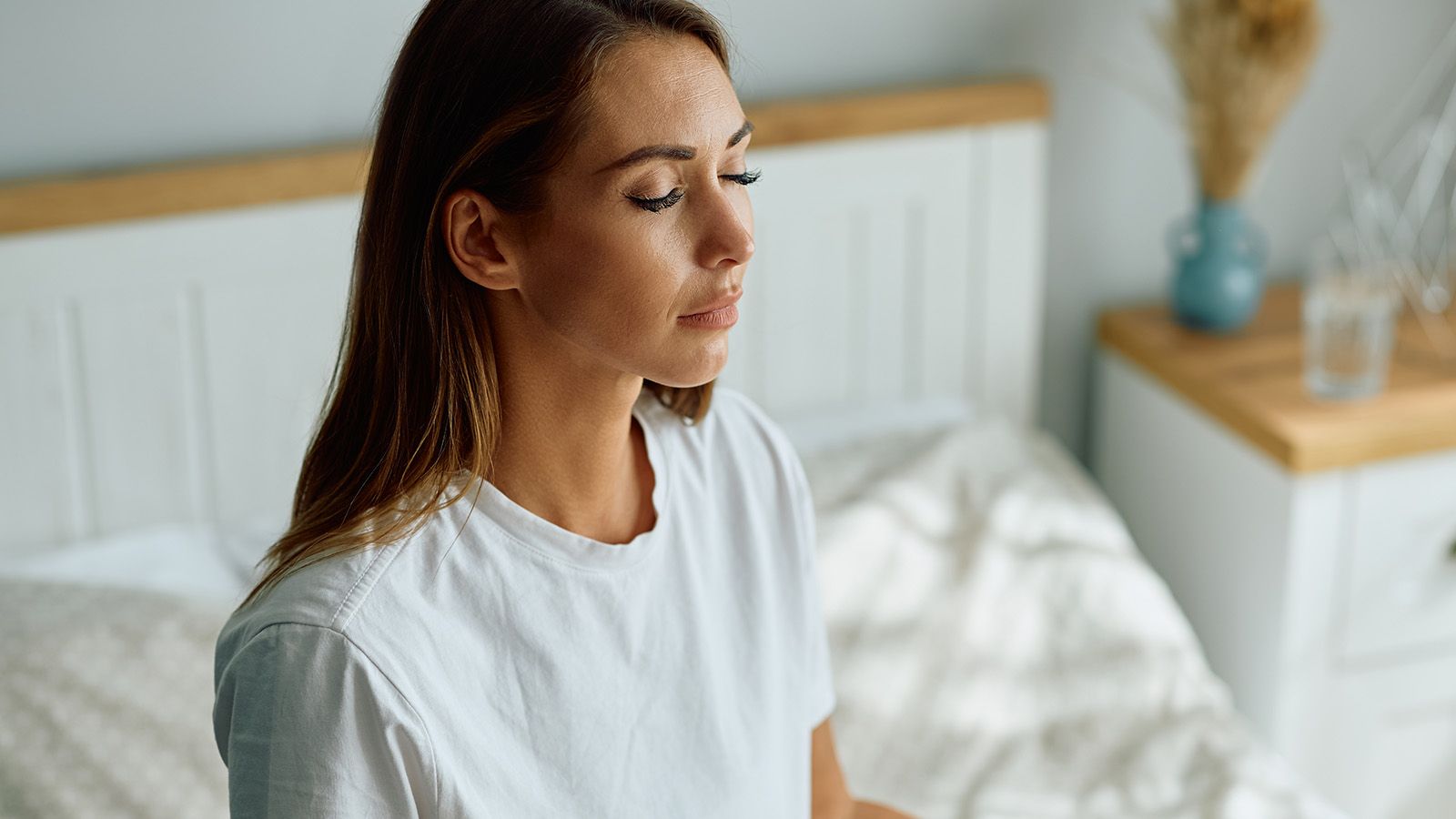 Attractive middle aged woman contemplating and meditating