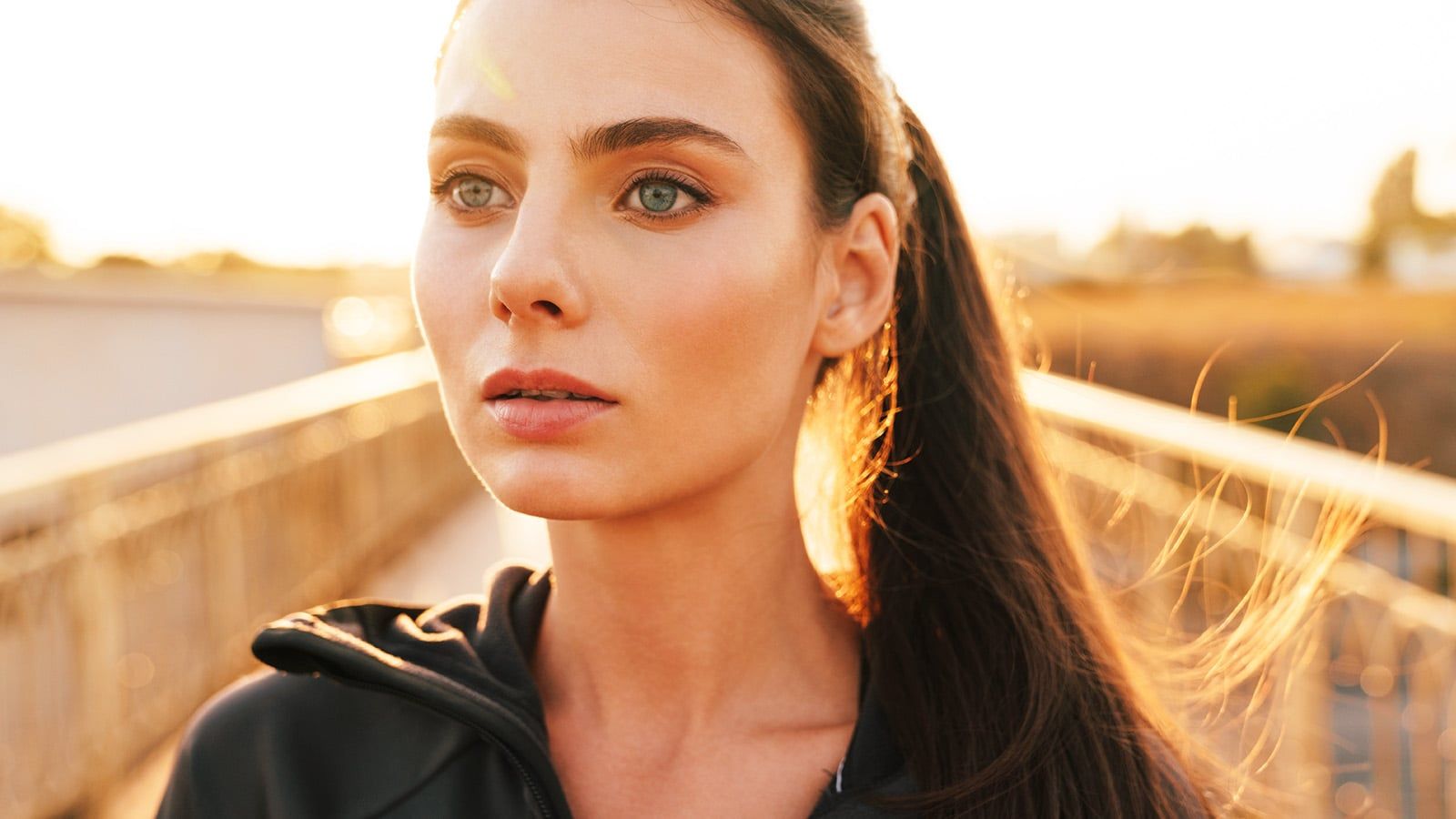 Image of a pretty gorgeous young amazing sports fitness woman posing outdoors.