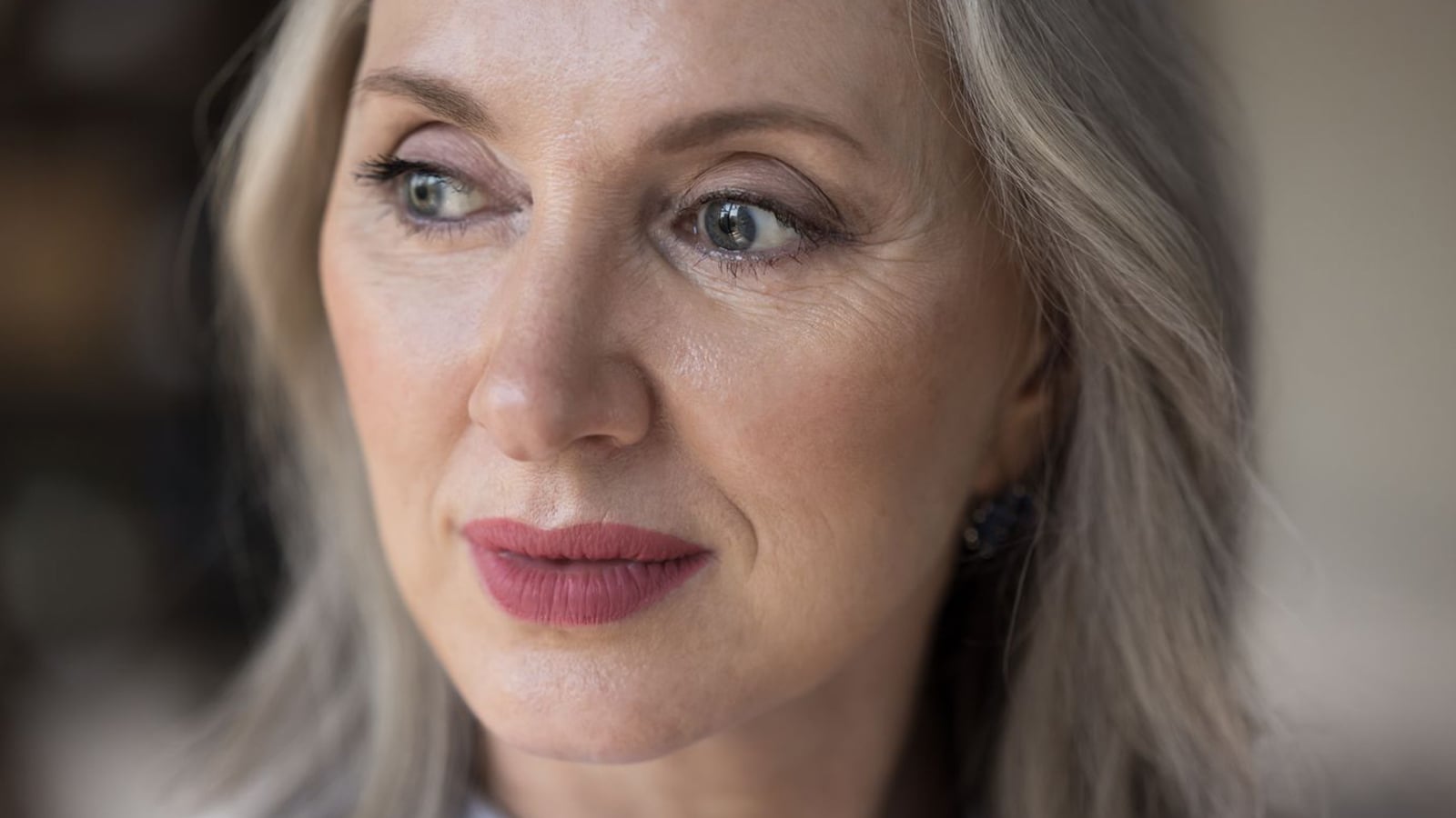A middle aged woman thinking about her single life.