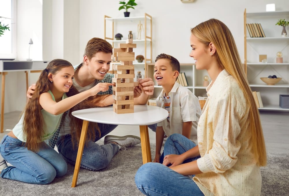 A happy family playing jenga