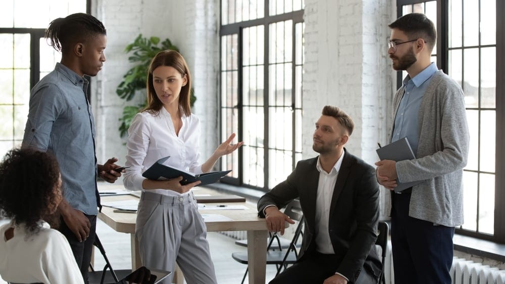 A business woman discussing business with colleagues