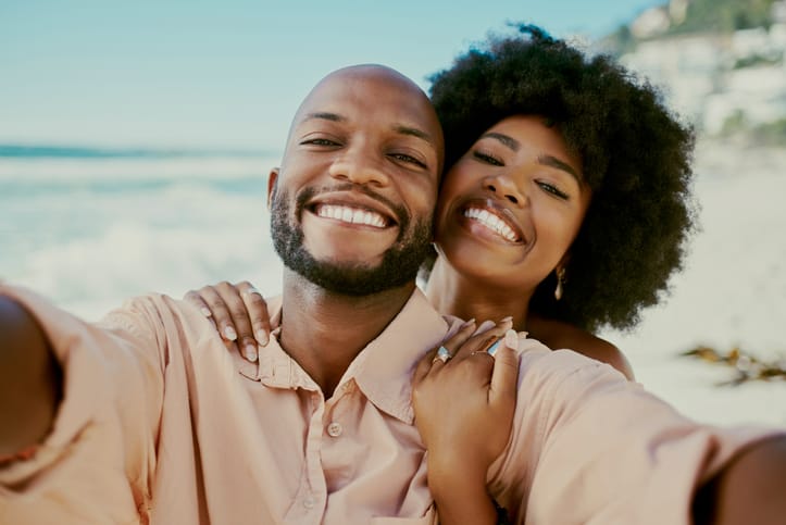 Man and wife on the beach.