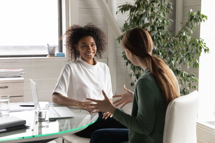 woman talking to her boss at work