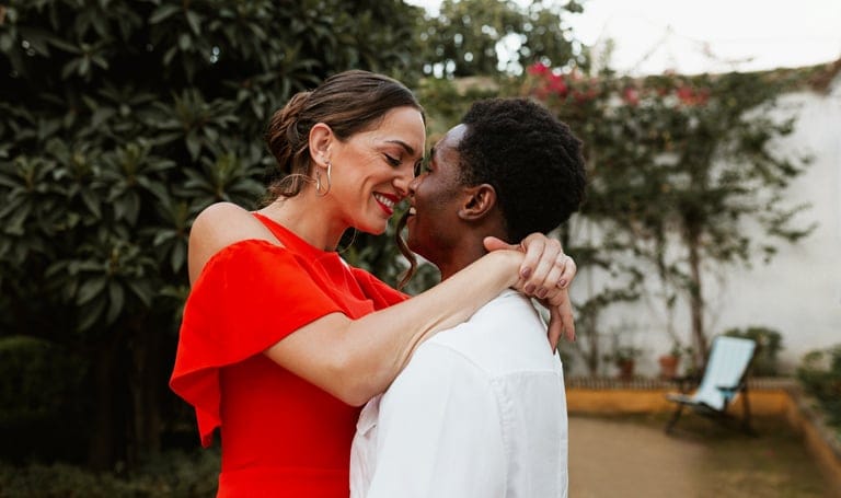 happy couple embracing mixed race