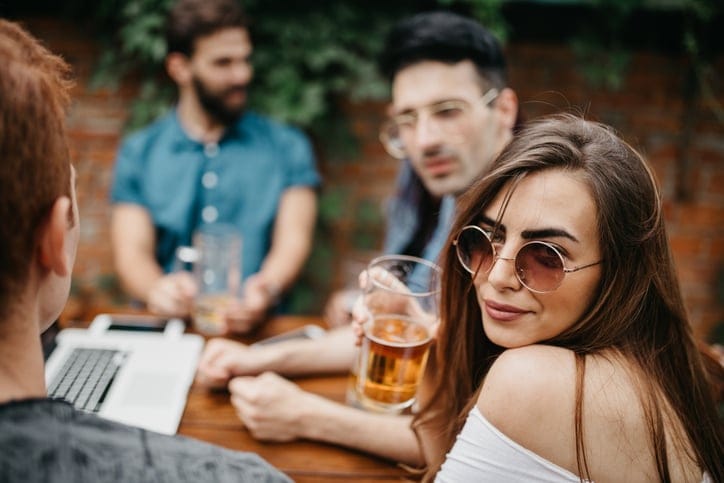 woman sitting drinking beer